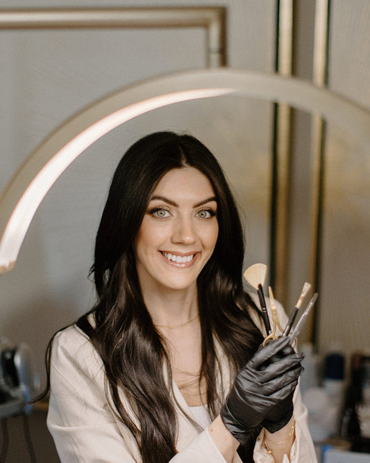 Aesthetician holding tools used for lash lift and tint at Bloom Aesthetics medspa