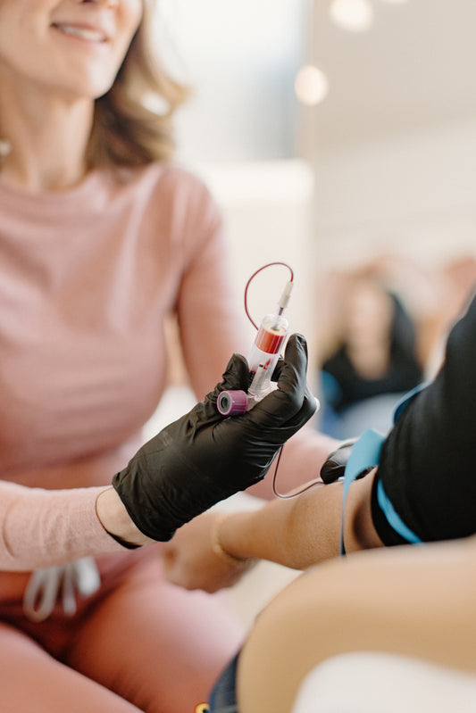 Aesthetic nurse extracting natural growth factors from the arm for PRP and PDGF treatment at Bloom Aesthetics